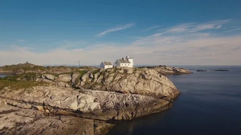 Flying Over Old Lighthouse In  Norwegian Fishing Village Of Henningsvaer Stock-Footage 78001811