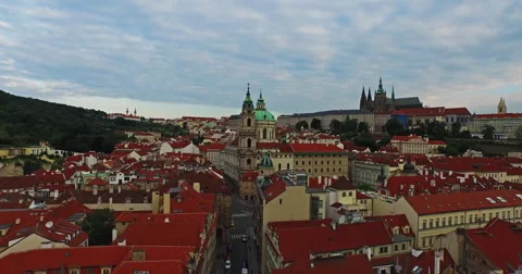 Flying over the old rooftops of Prague from the Charles Bridge Stock Footage 61077136