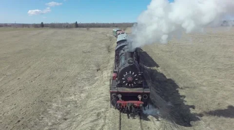 Flying over old steam train from front Stock Footage