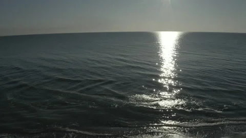 Flying over the open ocean at sunset. Stock Footage 241313915