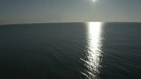 Flying over the open ocean at sunset. Stock Footage 241314022