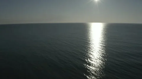 Flying over the open ocean at sunset. Stock Footage 241314254
