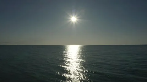 Flying over the open ocean at sunset. Stock Footage 241318030