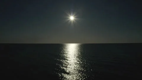 Flying over the open ocean at sunset. Video stock 241318092