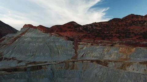 Flying over open pit copper mine in Bisbee, AZ Stock Footage 101814118