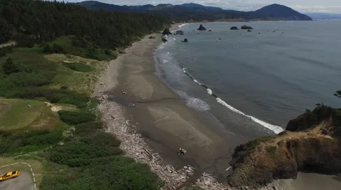 Flying over an overcast oregon beach | port orford Stock Footage 53302235