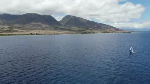 Flying over the pacific ocean towards the west maui mountains	 Stock Footage 138329239