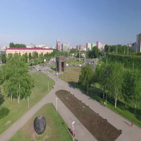 Flying over the park and the circular intersection 스톡 동영상 69275747
