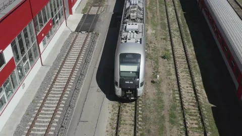 Flying over passenger train standing near platforms. Few 動画素材 209616153