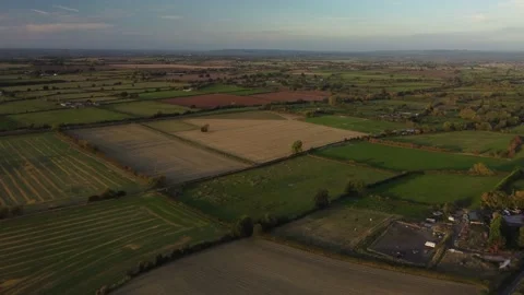 Flying over the patchwork of fields, UK in autumn Video stock 218471728