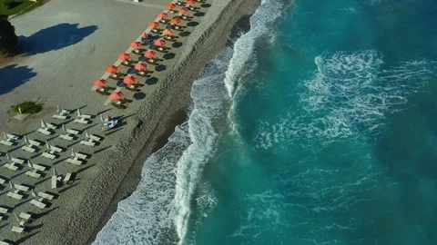 Flying over a pebble beach with waves and surf, Rhodes island, Greece, views of Stock Footage 118291875