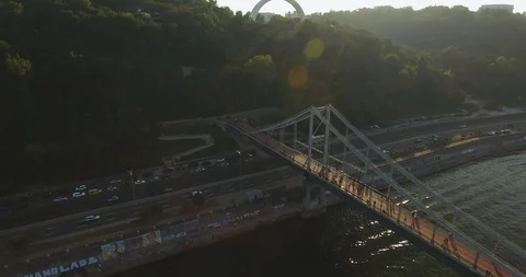 Flying Over Pedestrian Bridge Over River At Sunset. Drone Shot Stock Footage 95335191