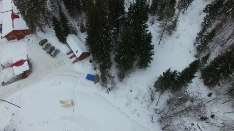 Flying over pines, spruce and trees towards frozen river top view aerial. Stock Footage 92854502