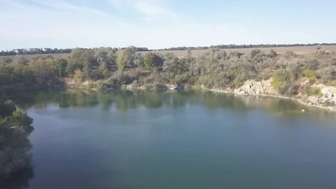 Flying over the pit lake Video stock 120480436
