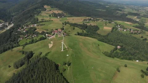Flying over Polom Mountain and running wind turbine in Beskids Mountains Stock Footage 140072358