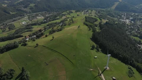 Flying over Polom Mountain next to wind turbine. Beskid Sadecki Mountains. Stock Footage 140071012