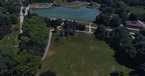 Flying Over Pond In Park Stock Footage 91258645