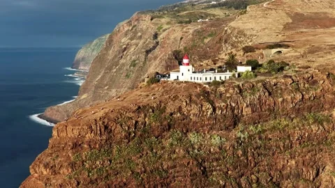 Flying Over Ponta do Pargo Lighthouse and Coastal Cliffs on Madeira Island Stock Footage 322806308