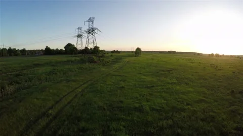 Flying over power line at sunset, aerial survey Video stock 50824985
