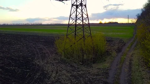 Flying over power line at sunset Stock Footage 75155261