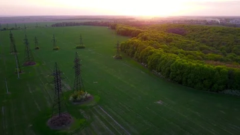 Flying over power line at sunset Stock Footage 75300404