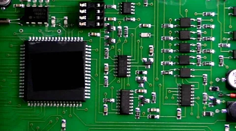  	Flying over the printed circuit board with chips and capacitors and resistors 스톡 동영상 58850844