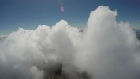 Flying over puffy white cloud formations Vídeo Stock 237403928