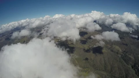 Flying over puffy white cloud formations Stock Footage 237408328