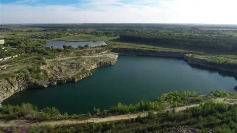 Flying over quarry lake Stock Footage 100662521