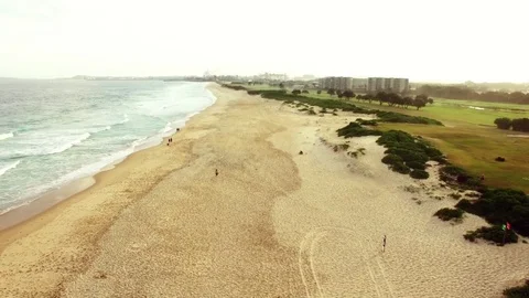 Flying over a quite beach during sunset Stock Footage 83534396