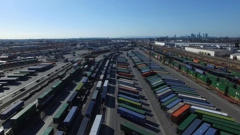 Flying over a rail yard stocked with shipping containers Stock Footage 89111674