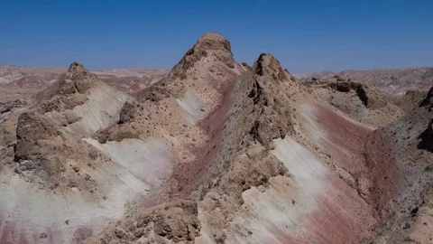 Flying over the red, colorful, rainbow mountains, covered with unique patterns Stock Footage 105804785
