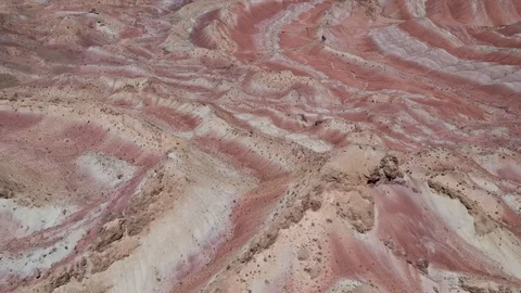 Flying over the red, colorful, rainbow mountains, covered with unique patterns Stock Footage 105804874