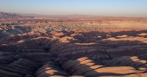 Flying over the red, colorful, rainbow mountains, covered with unique patterns Stock Footage 105845476