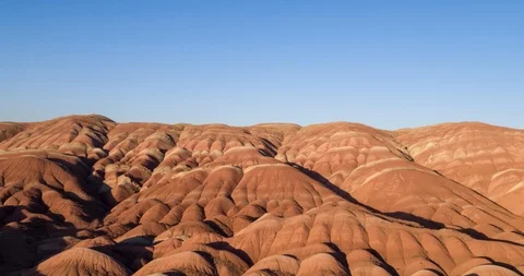 Flying over the red, colorful, rainbow mountains, covered with unique patterns Stock Footage 105847985