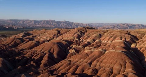 Flying over the red, colorful, rainbow mountains, covered with unique patterns Stock Footage 105848005