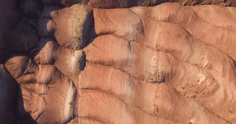 Flying over the red, colorful, rainbow mountains, covered with unique patterns Stock Footage 105849152