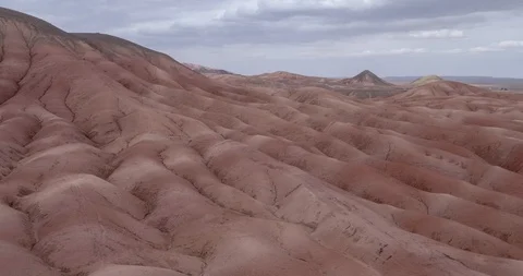 Flying over the red, colorful, rainbow mountains, covered with unique patterns Stock Footage 105850310