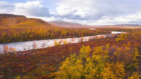 Flying over red desert looking northern river Stock Footage 212388301