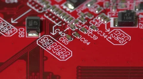 Flying over a red electronic circuit board, surface mount technology. Stock Footage