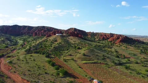Flying over Red Soil and Village Stock Footage 247955233