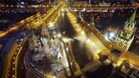Flying over Red Square. Moscow, Kremlin, cars, snow removal. Winter night Stock Footage