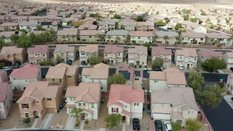 Flying over red tile rooftops of a southwestern suburban neighborhood Stock Footage 156749177