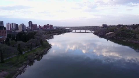 Flying over a reflecitve river Stock Footage 77713786