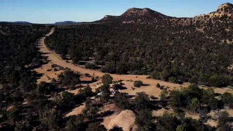 Flying over a remote 4x4 overland camp in the Utah desert Stock Footage 157436498
