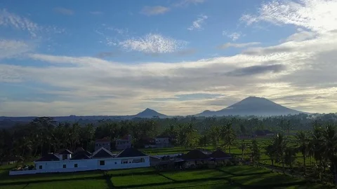 Flying over rice fields with volcano view 動画素材 74314990