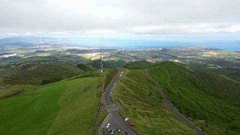 Flying over ridge peak mountain Low Flight Over view city ocean, Islands Azores Stock Footage 221504562