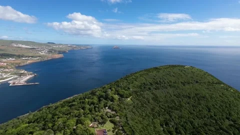 Flying over ridge peak mountain Low Flight Over view city ocean, Islands Azores Stock Footage 221509675
