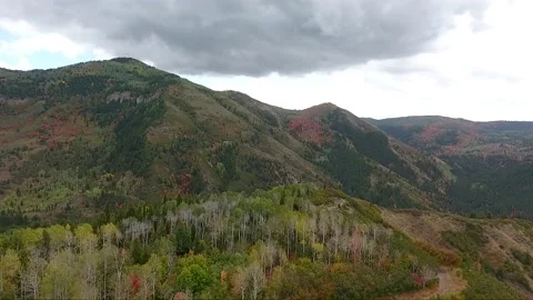 Flying over a ridge in the Wasatch Mountains, a drone reveals the Stock Footage 131148309