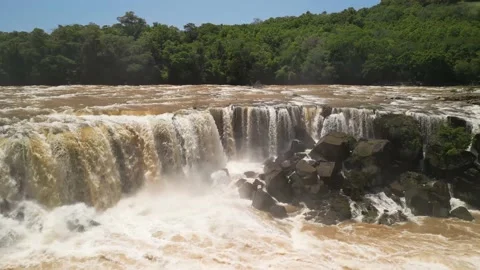 Flying over a river amid waterfalls and beautiful nature.Salto Saudades. 4K. Video stock 233219693